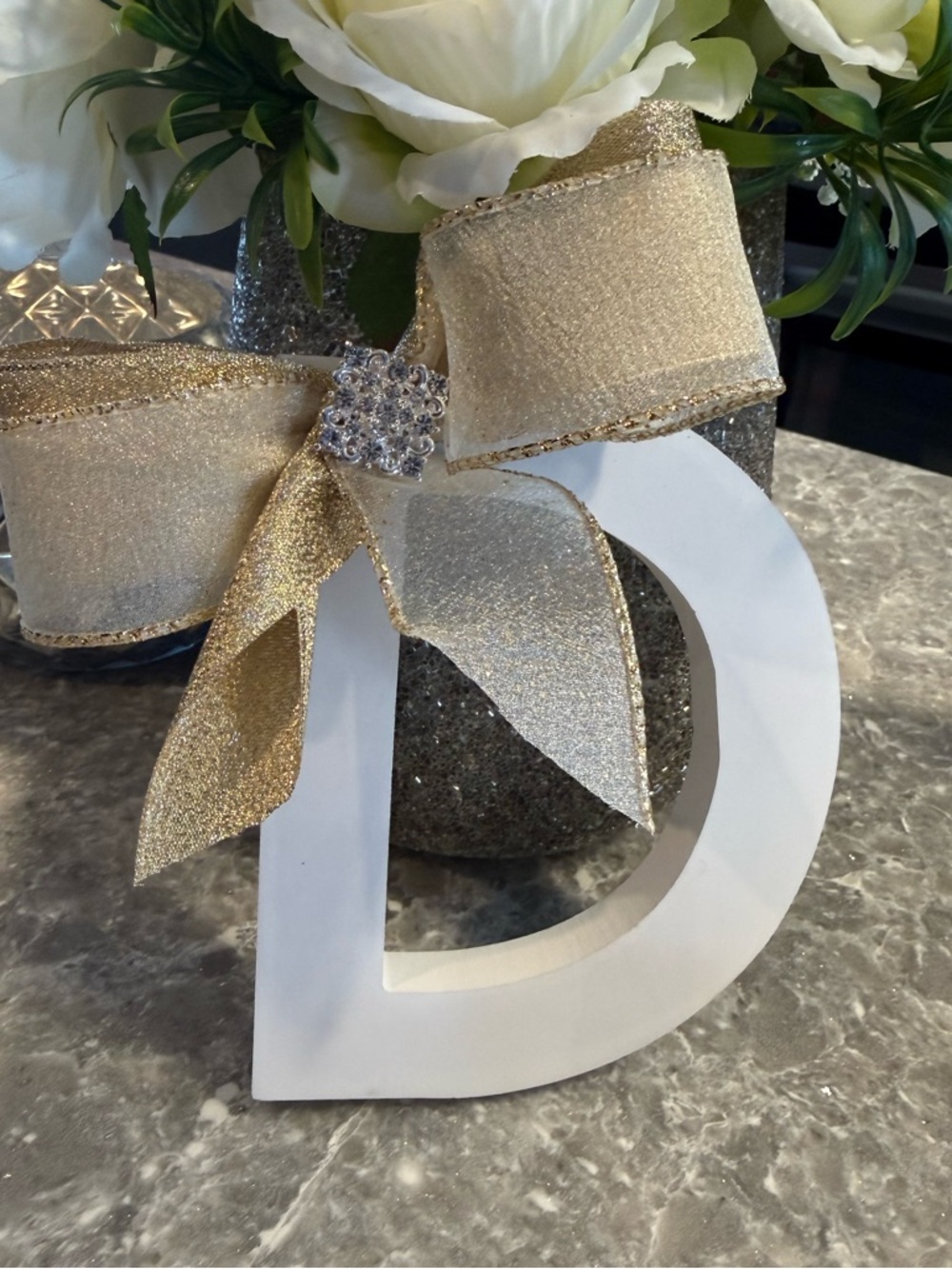 White Decorative Letter D with Gold Ribbon